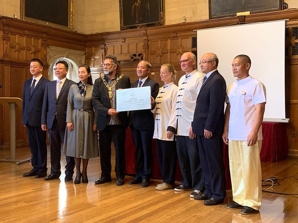 Officials, the Lord Mayor of Oxford and Shifu Liu with a presentation plaque in Oxford Town Hall