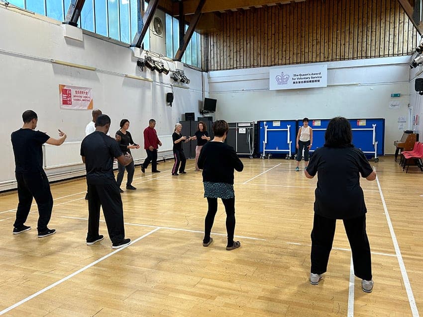 Students practising Chen Taiji in a sports hall during a foundation workshop